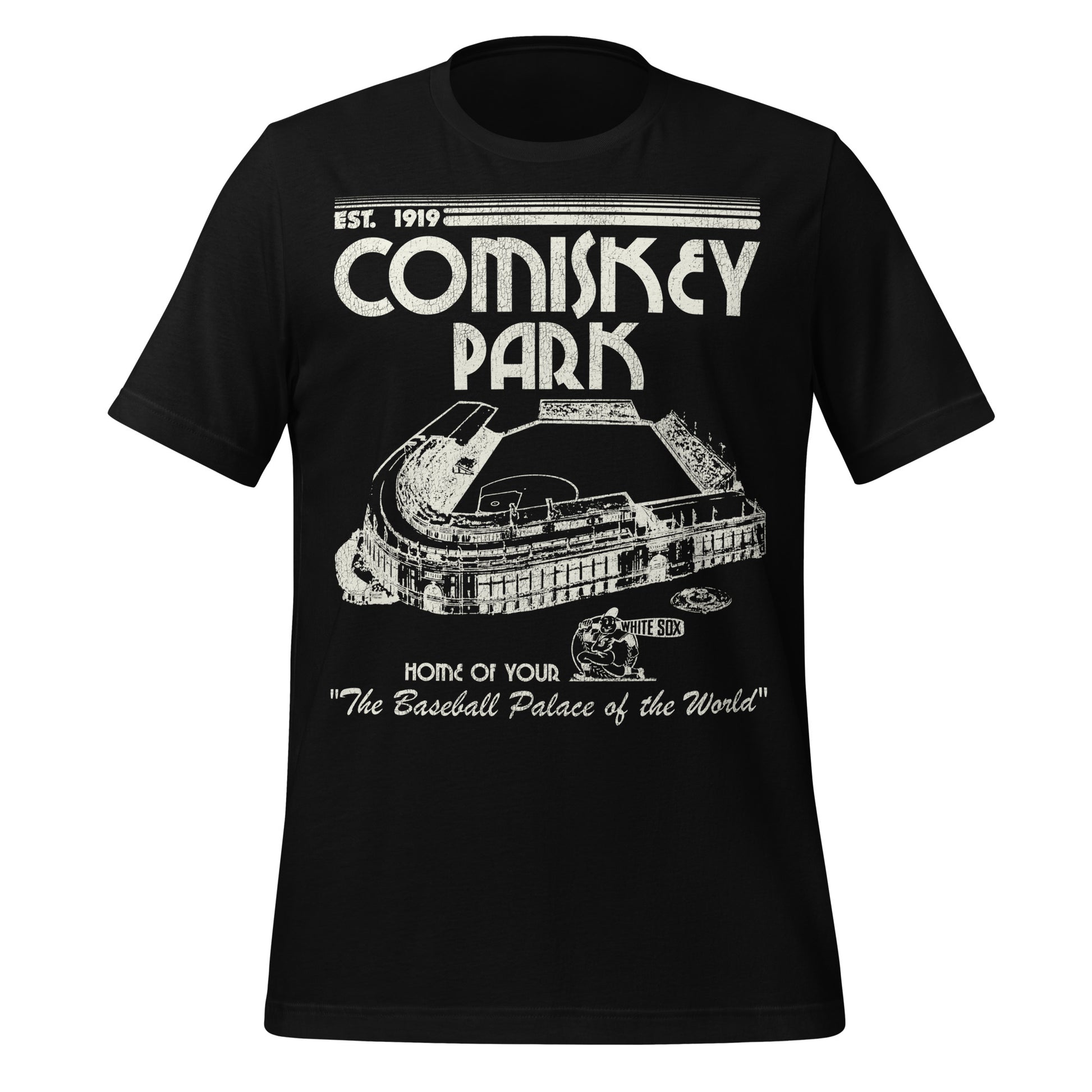 A black vintage short sleeve t-shirt that says Comiskey Park, Home of Your White Sox, and "The Baseball Palace of the World" and was "Est. 1919". References the historic home stadium for the Chicago White Sox in the years 1910-1990 and first known as White Sox Park. Image of the huge baseball stadium and a baseball player with a bat that says "White Sox". 