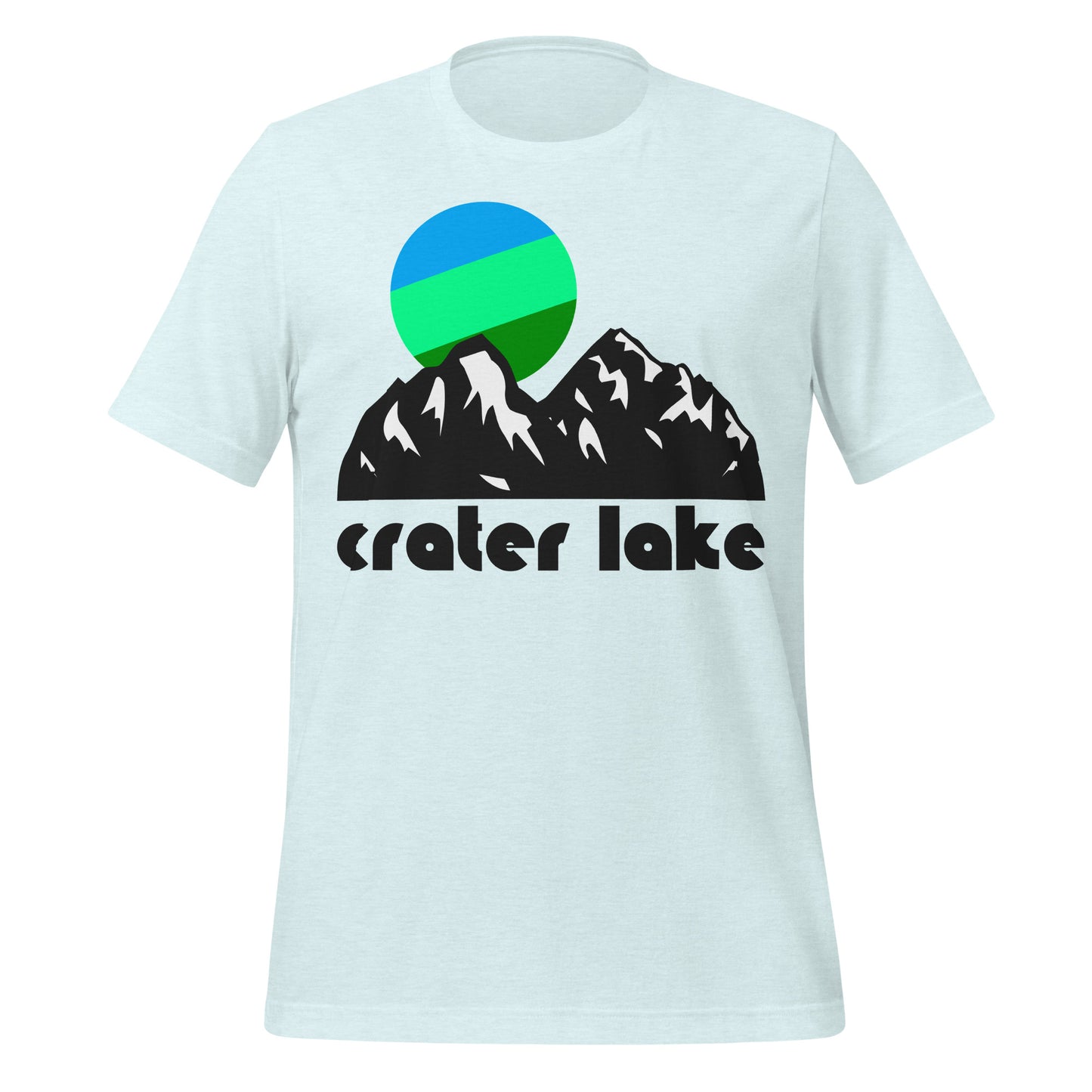 A souvenir, ice blue colored t-shirt that reads "Crater Lake" and includes the image of a cool toned green and blue sun hanging above the peaks of a mountainous landscape, representative of the Cascade Mountains in Oregon. In reference to Crater Lake National Park, its namesake a volcanic caldera which is now filled by Crater Lake, the deepest lake in the US. 