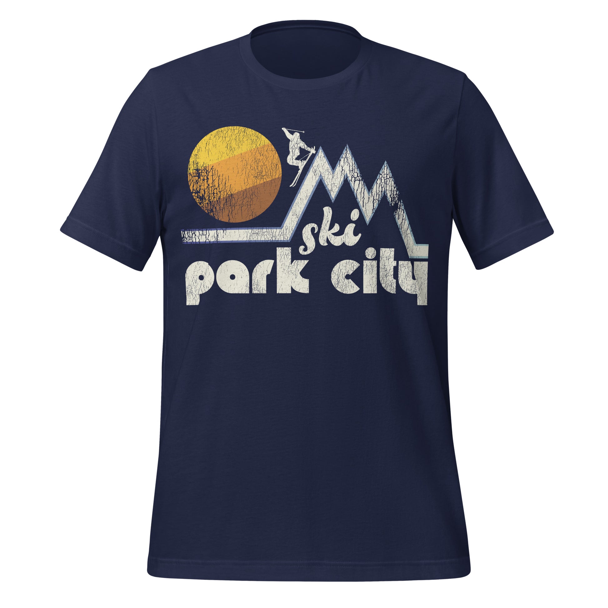 A retro 80s style "Ski Park City" navy t-shirt with the image of a couple mountain peaks and a skier heading down, a beautiful striped yellow, orange, and brown sun in the distance. References the city in Utah which includes Park City Mountain resort, one of the largest resorts in the US. 