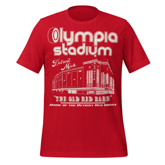 A bright red 80s style Olympia Stadium t-shirt that says "Detroit, Mich.", the location of the stadium. Image of the stadium nicknamed the "The Old Red Barn". Says "Home of the Detroit Red Wings", referencing the hockey team based in Detroit, part of the NHL. Also housed the Detroit Pistons and the Detroit Olympics teams. 