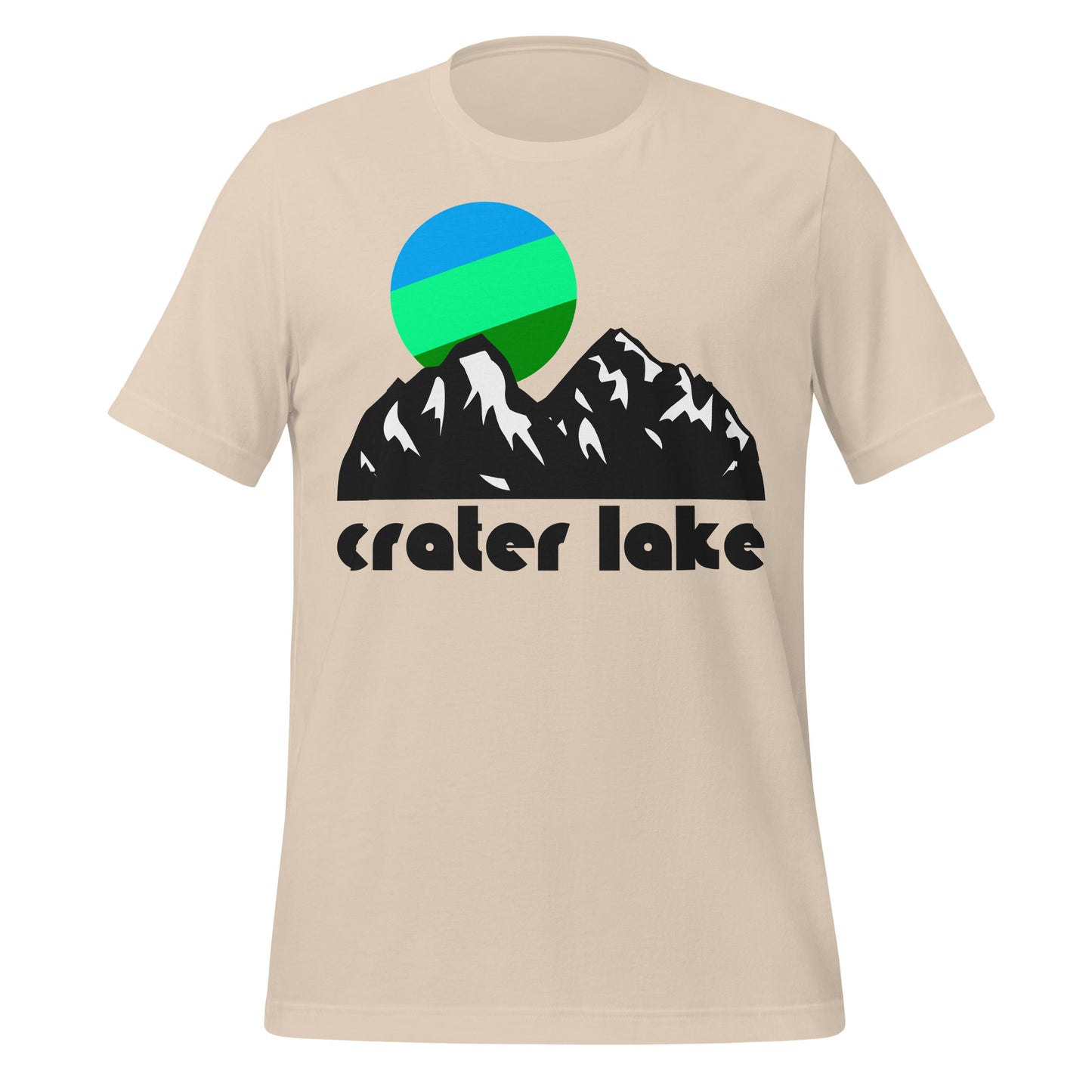 A soft cream colored 80s style souvenir t-shirt that says "Crater Lake" and includes the picture of a large, rugged mountain landscape with a striped cool colored sun shining. In reference to Crater Lake National Park, a beautiful destination for fishing, backpacking, birding, and the stunning Scenic Rim Drive and famous Cleetwood Cove Trail. 