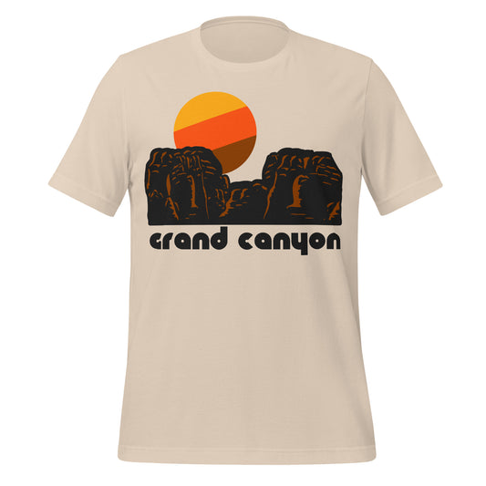 A soft cream colored retro t-shirt that says Grand Canyon under the image of a red rock formations and a stylized yellow, orange, and brown sun. In reference to the world famous Grand Canyon National Park with popular hikes like the Canyon Rim Trail, mule rides, white water rafting on the Colorado River, and brilliant and iconic views from the South Rim. 