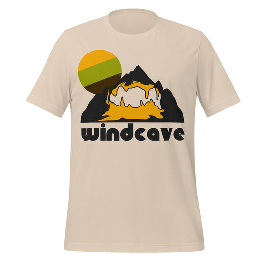 A soft cream colored Wind Cave National Park t-shirt with the image of a dark black mountain, a yellow cave system within, and a white trail highlighted as the sun sets in the background. The first cave system to be designated a national park, Wind Cave is known for having the most boxwork formations of any cave and was caused by fractures in rock with water seeping through. 
