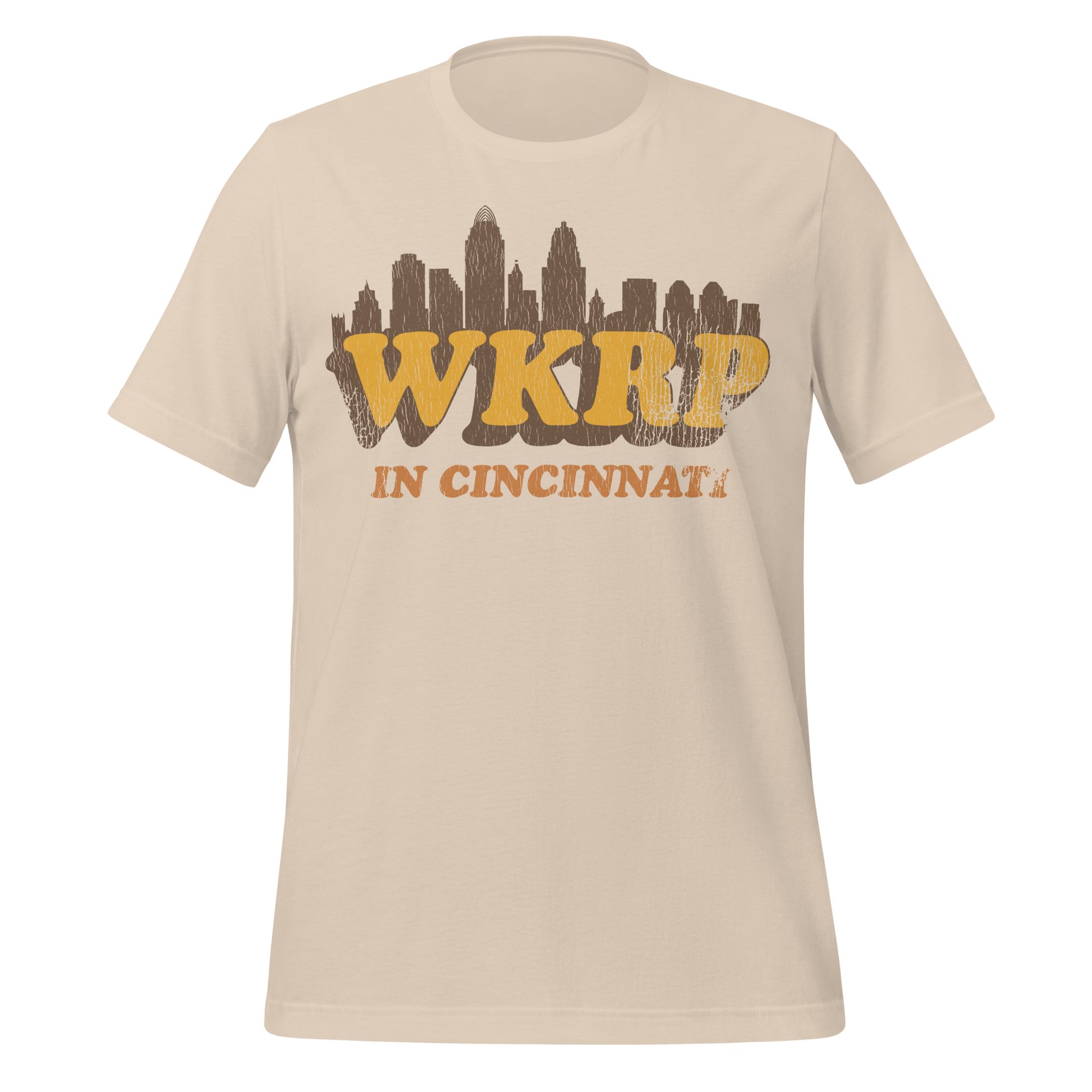 A soft cream vintage t-shirt that says WKRP In Cincinnati with an image of the Ohio city's skyline. References the sitcom which ran for 4 seasons. 