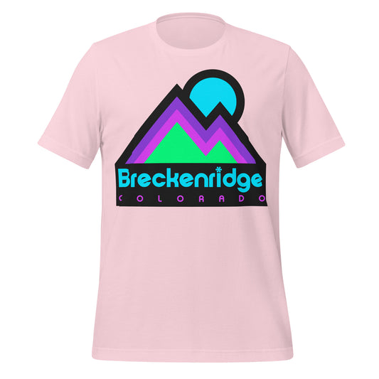 A soft pink Breckenridge, Colorado t-shirt with images of mountains and a sun. References the popular town in the heart of the Rocky Mountains known for its skiing, snowboarding, snowshoeing, and hiking opportunities, as well as its art scene, rich mining town history, and stunning mountain views. 
