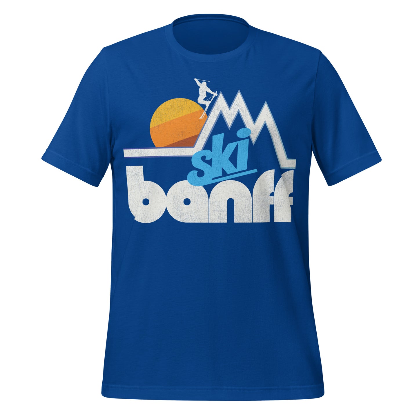 A true royal blue retro, 80s style t-shirt that says "Ski Banff" with the image of a couple mountain peaks and a skier doing a stylish jump as a yellow/orange/brown sun sets. References Banff National Park in Alberta's Rocky Mountains, Canada's first national park. 