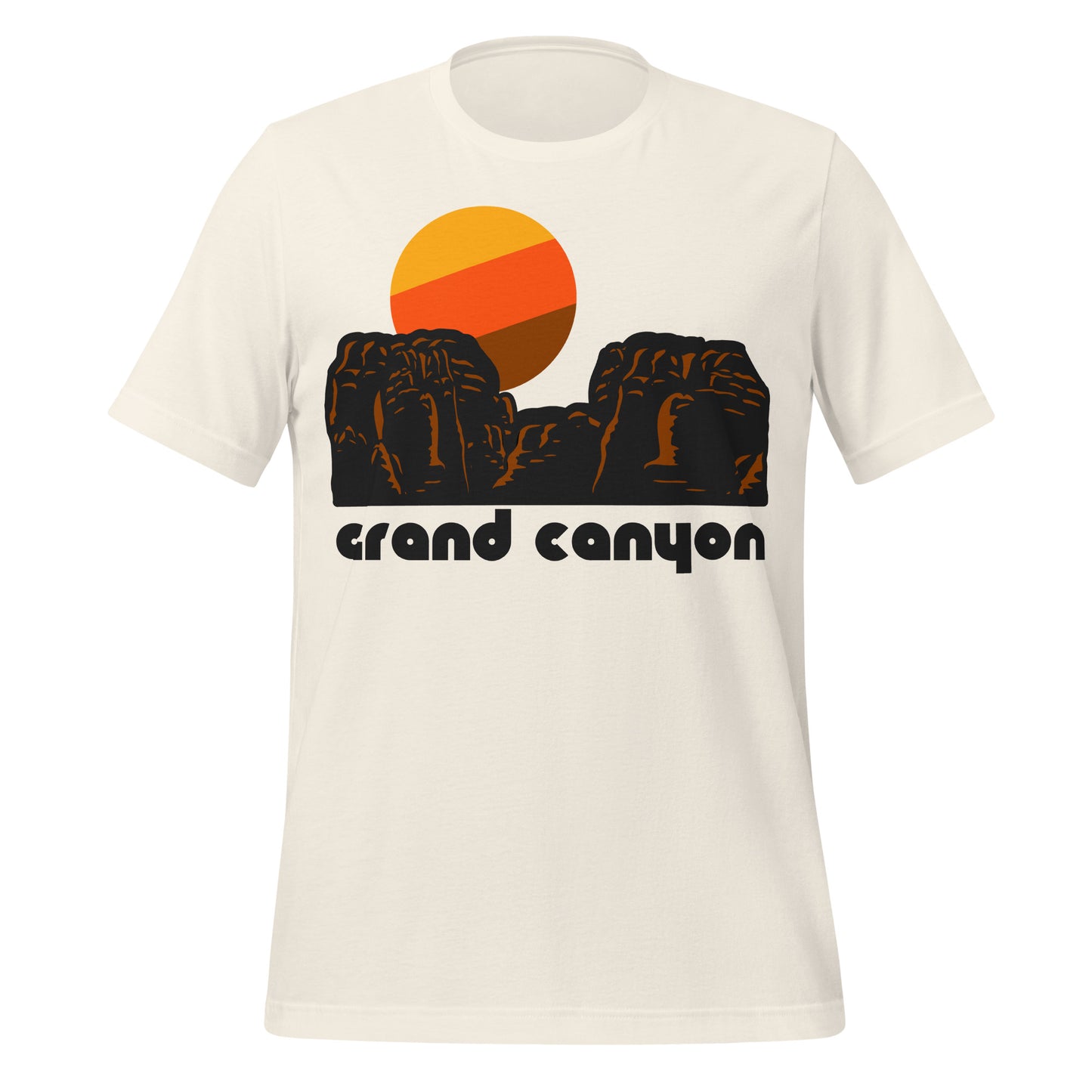 A vintage white 80s style short sleeved t-shirt that says "Grand Canyon" underneath the image of a red rock canyon and a rising yellow, red, and brown sun in the distance. References Grand Canyon National Park, one of the most famous tourist attractions in the United States, with incredible hikes down to the Colorado River and beautiful sites like Havasu Falls, Hopi Point, and the Historic Navajo Bridge.  