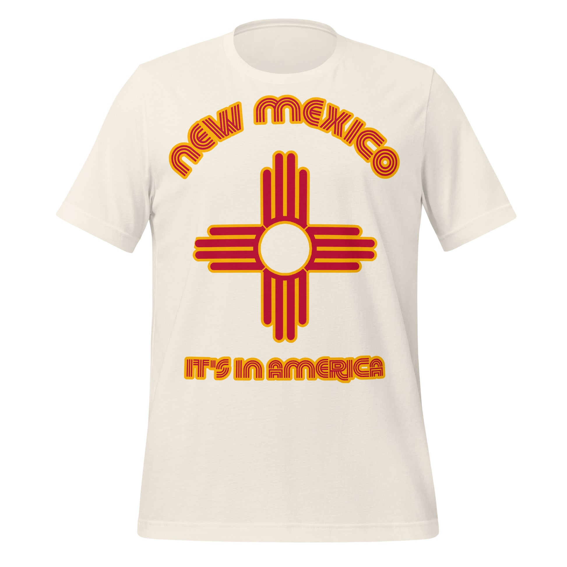 A vintage white colored short sleeved retro New Mexico t-shirt that says "It's in America" in red and yellow colors with the symbol from the Zia tribe, representing a sun design, and also north, south, east, and west as well as the four stages of life, now found on the modern NM state flag. 