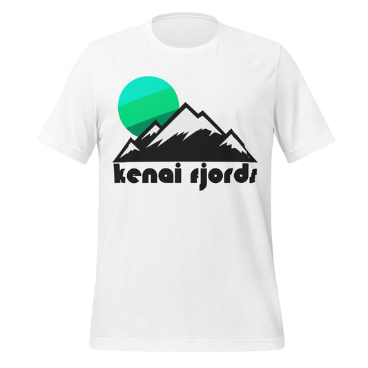 A vintage souvenir Kenai Fjords white colored tshirt with a snowy mountain landscape image complete with a beautiful sun setting in bright green and blue colors. In reference to Alaska's Kenai Fjords National Park, famous for its many glaciers, for the Harding Icefield, and for its coastline on the North Pacific Ocean, a popular hiking destination. 