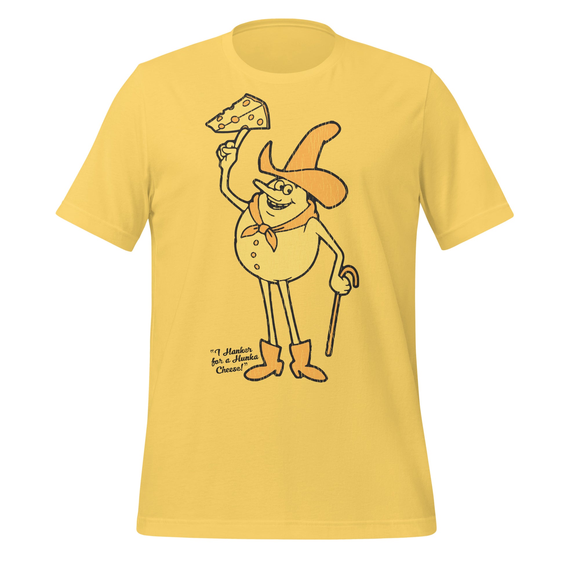 A yellow retro short sleeve t-shirt that says "I Hanker for a Hunka Cheese!" with  an image of a cheese cowboy man with a hat, a scarf, a cane, and boots holding a piece of cheese with holes. Refers to Timer from the series 'Time for Timer'. 